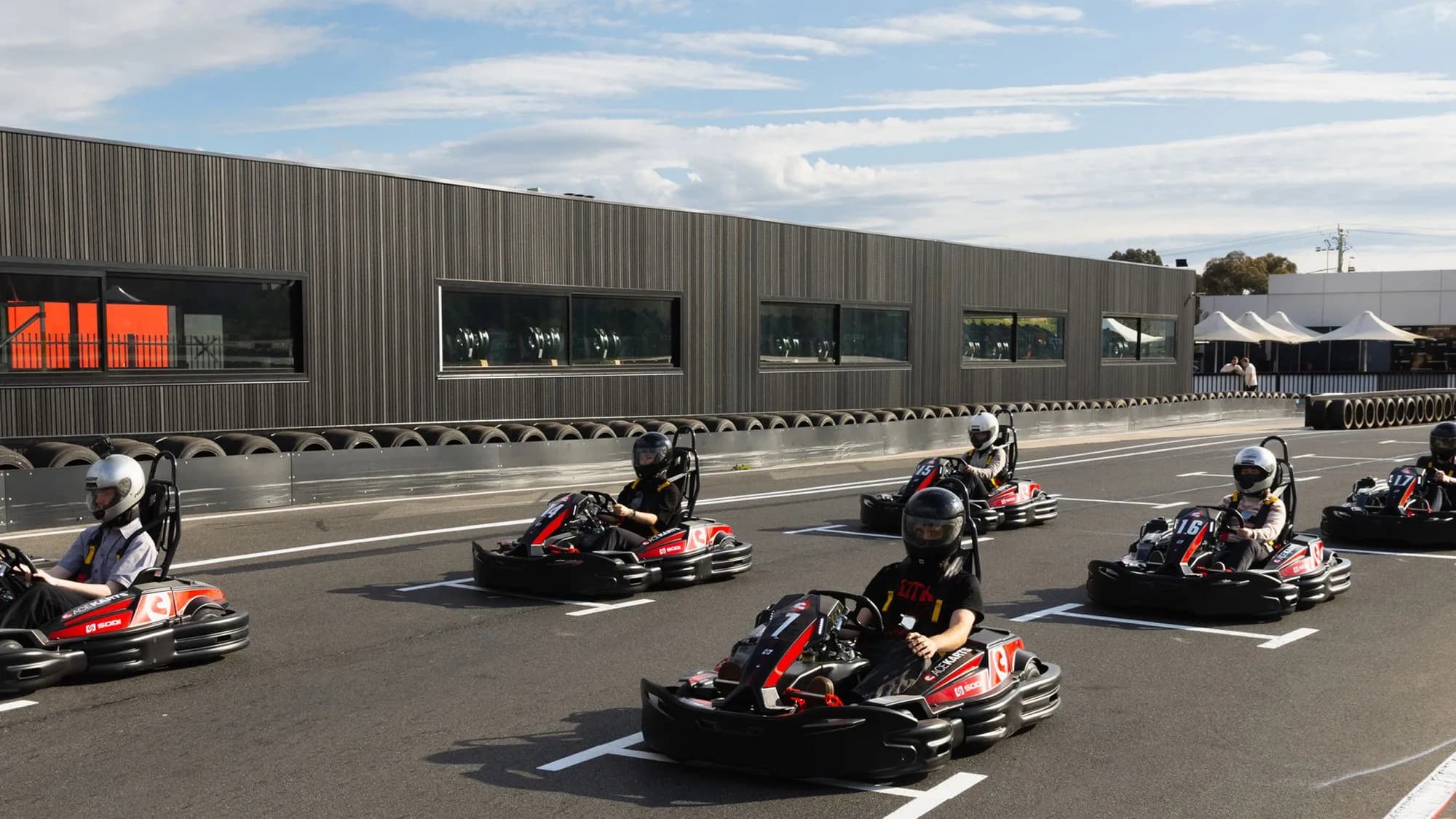 Ace Karts drivers lined up on Melbourne's outdoor circuit